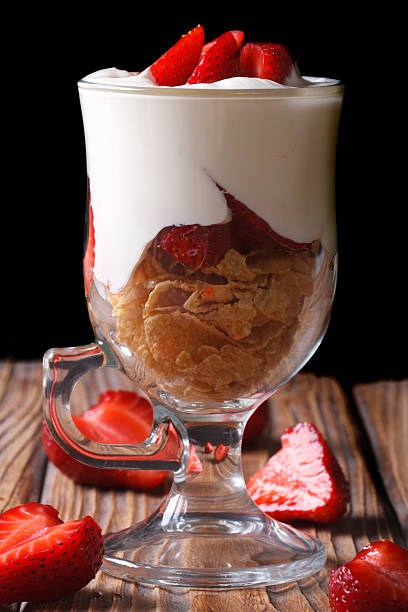 istock yogurt with strawberries and cornflakes on a dark background 504289621