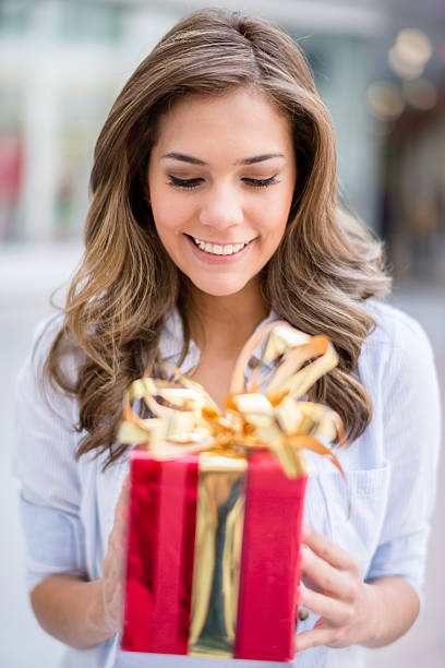 istock Woman holding a present 504290775
