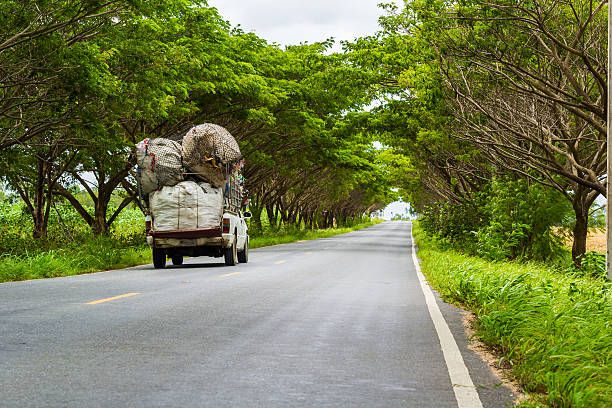 istock truck carrying things  on urban road 504290909