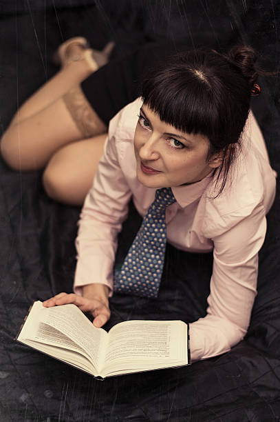 istock sexy girl reading a book 504293565