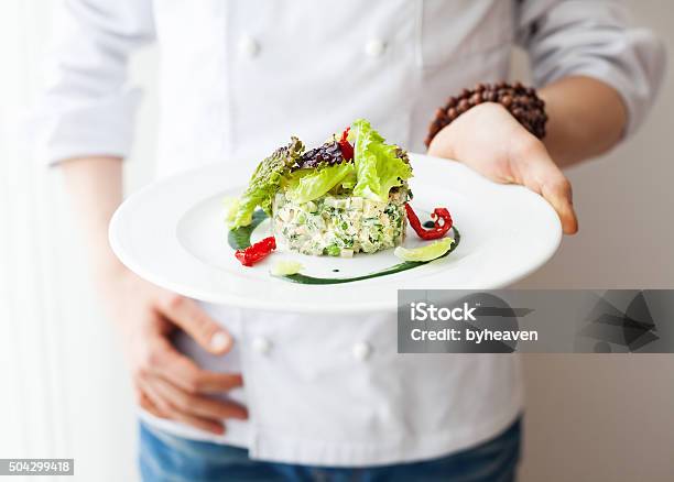 Healthy Raw Vegan Salad In Restaurant Stock Photo - Download Image Now - Chef, Food, Holding