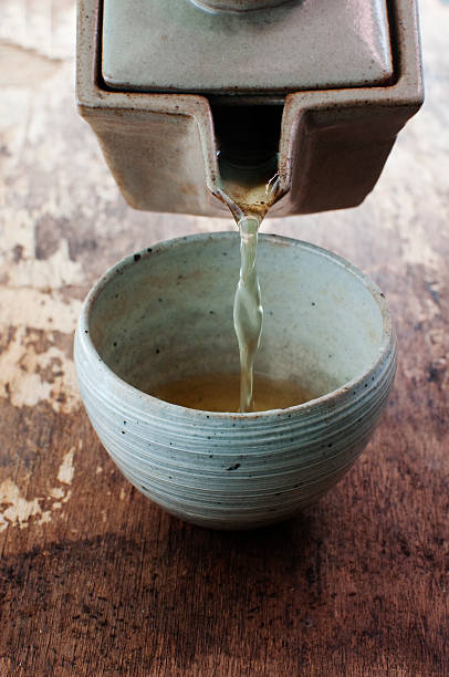 istock pouring green tea in a bowl 504301712
