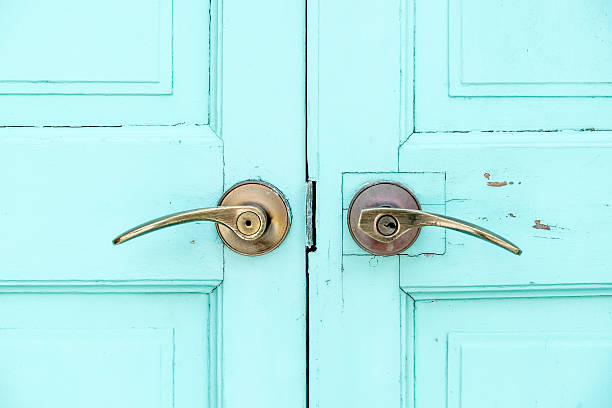 istock close up Brass door handle at wood blue door 504302168