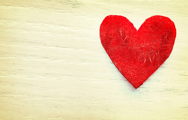 istock Retro stylized heart made of beet on grunge background. 504302392