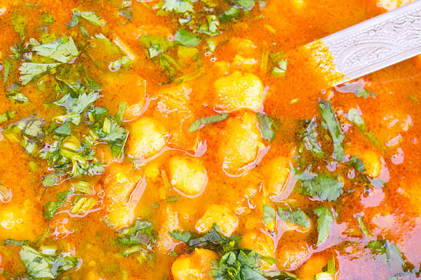 Indian potato gravy dish garnished with coriander