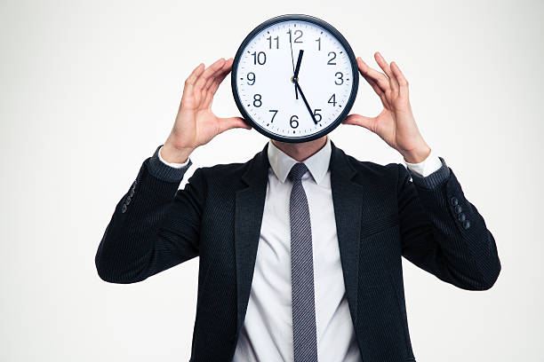 istock Businessman in black suit with clock instead of head 504304946