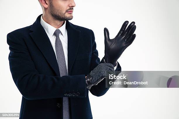 Handsome Young Man In Black Coat Wearing Leather Gloves Stock Photo - Download Image Now