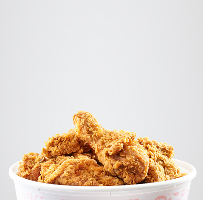 crispy kentucky fried chicken bucket in a white background