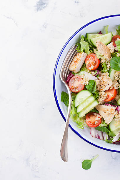 istock Salad with chicken, vegetables, bulgur and olive oil 504308720