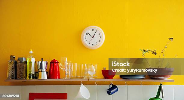 Yellow Wall Clock In The Kitchen Stock Photo - Download Image Now - Kitchen, Clock, Yellow