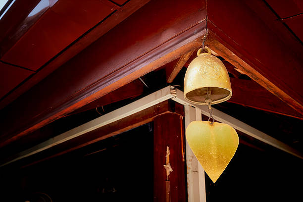 istock Brass bell hang on wooden roof 504309586
