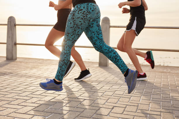 istock Young people running along the sea 504310872