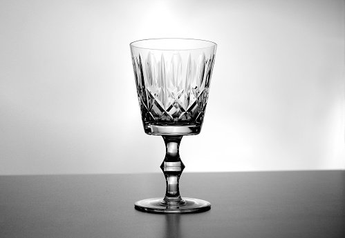 Black and white empty vintage crystal wine glass