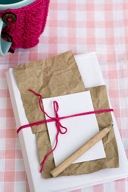 istock Old notebook for love notes and blue cup in sweater 504313862