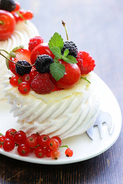 istock traditional summer dessert pavlova with fresh berries 504314915