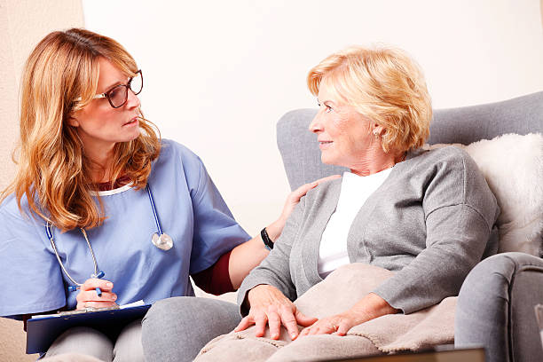 istock Home caregiver and senior patient 504315620