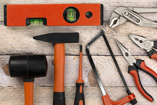 istock Carpenters tools on wooden background 504315940