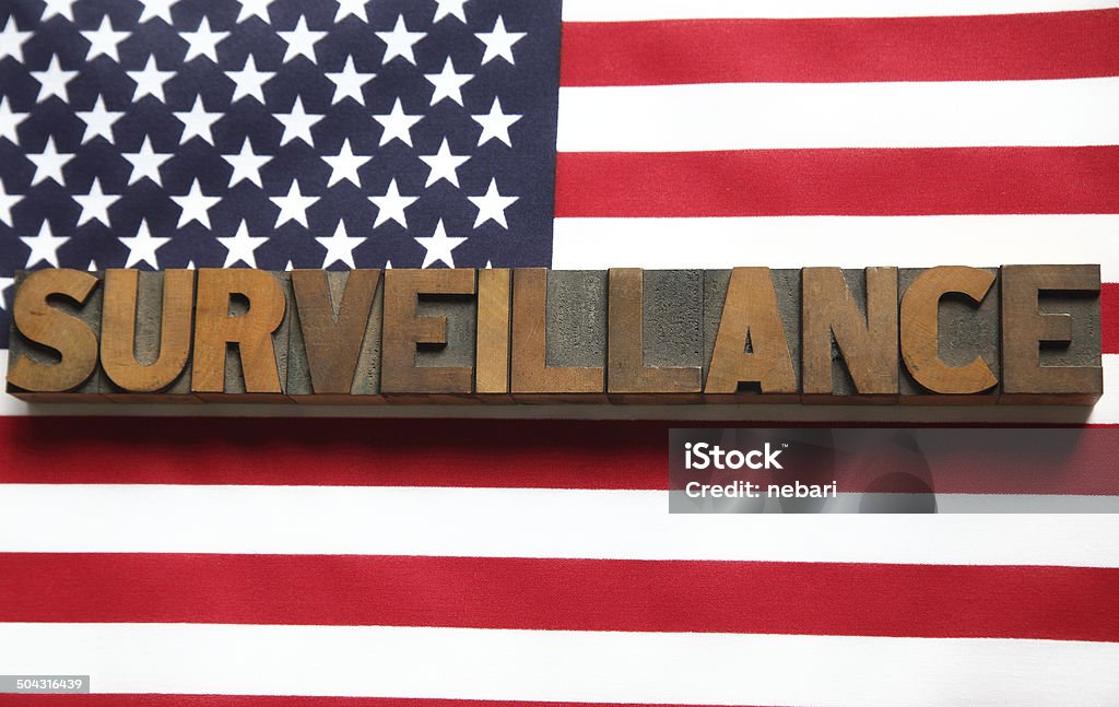 surveillance word on USA flag the word 'surveillance' on an American flag American Culture Stock Photo