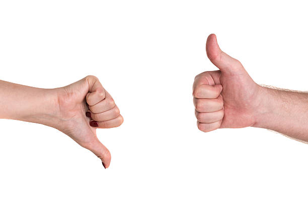 istock Thumbs up and down showing disagreement 504316707