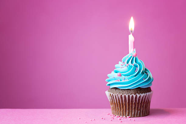 Birthday cupcake Birthday cupcake with a single candle cupcake candle stock pictures, royalty-free photos & images
