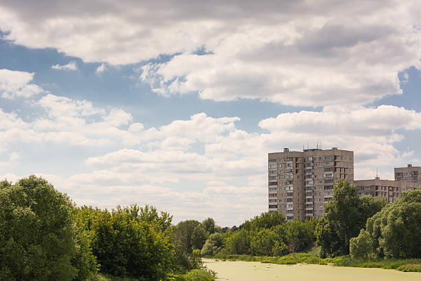 istock Suburban landscape with the image of trees and river 504319285