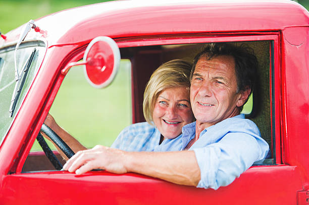 istock Senior couple in red car 504329842