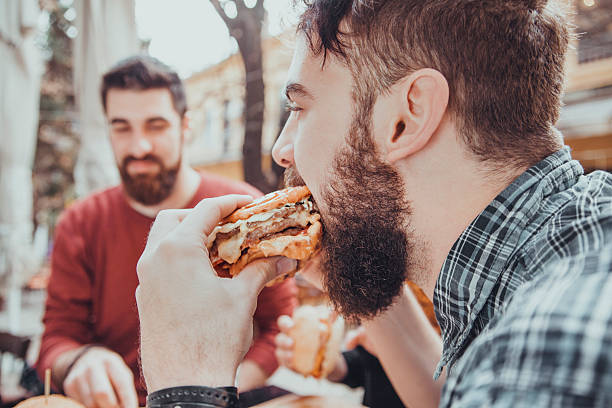 istock Friends In Fast Food Restaurant 504332556