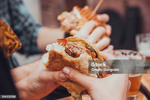 Female Eating Burger Stock Photo - Download Image Now - 20-29 Years, Adult, American Culture