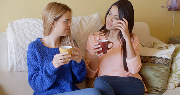 istock Two pretty young women enjoy a relaxing coffee 504335226