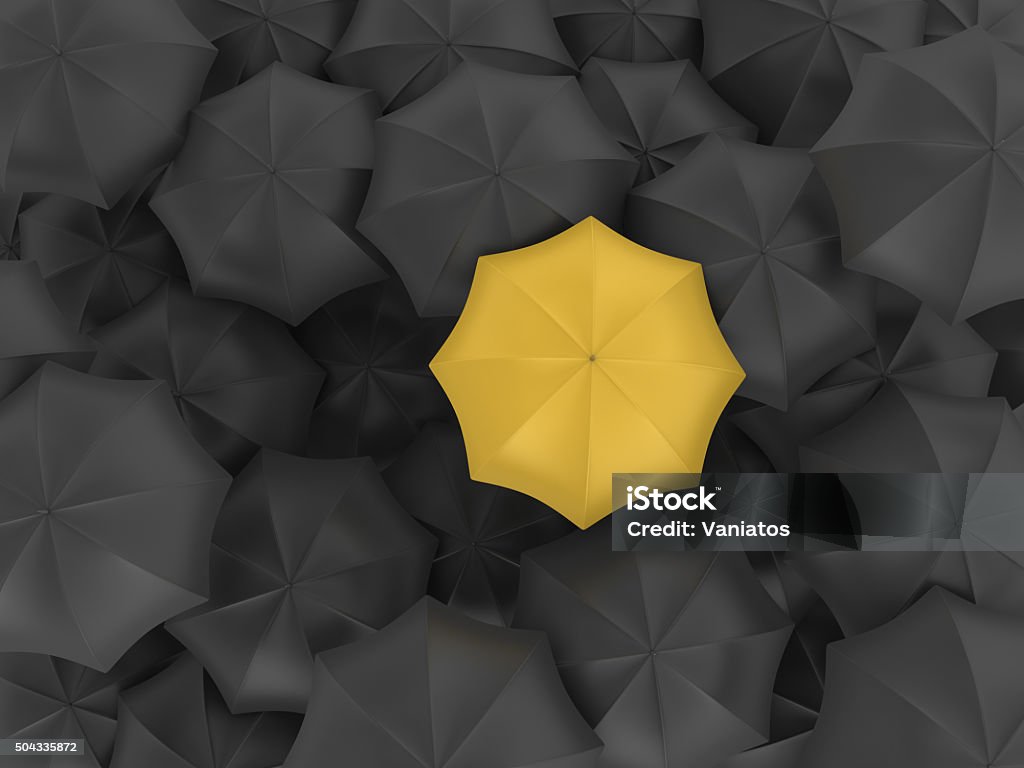 Yellow Umbrella with Many Black Ones Umbrella Stock Photo