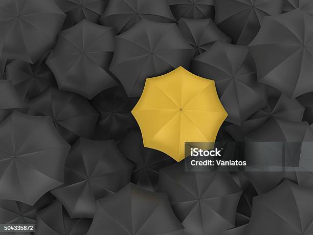 Yellow Umbrella With Many Black Ones Stock Photo - Download Image Now - Umbrella, Yellow, Insurance