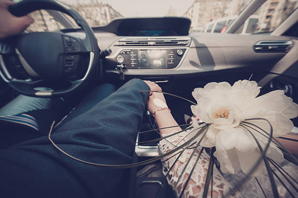 istock happy couple driving in the car 504335982