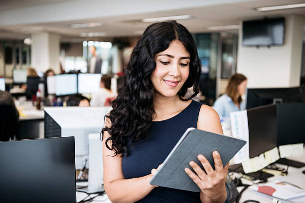 istock Middle Eastern businesswoman using tablet in modern office 504336348
