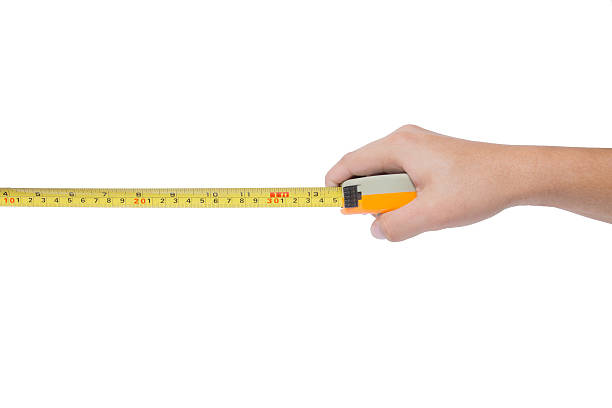 istock Hand holding tape cartridge meter isolated on white 504337330
