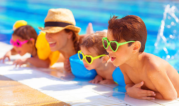 istock Happy family in the pool 504337909