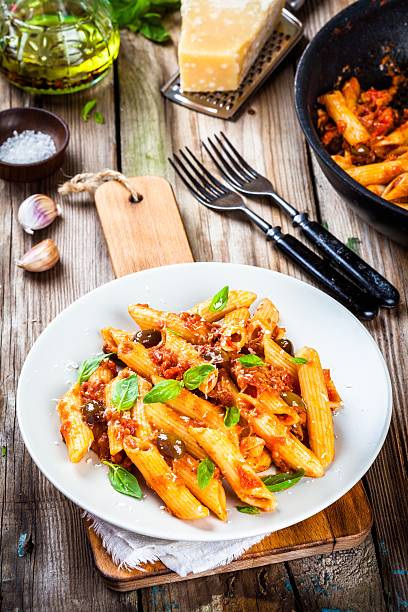 istock Italian penne pasta with tomato sauce 504338372
