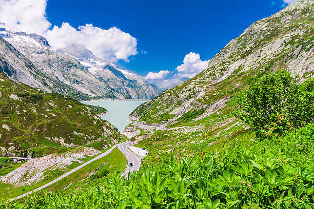 Top of the Grimsel pass in Swiss Alps View from the top of the Grimsel pass to the valley with the lake in Swiss Alps and beautiful sunny weather grimsel pass photos stock pictures, royalty-free photos & images