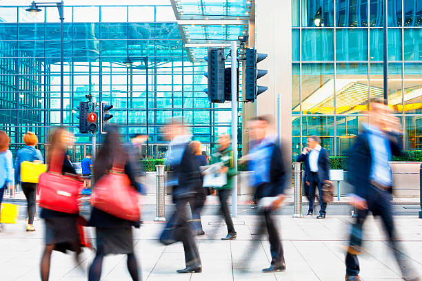 istock Blurred People Walking in Front of Modern Office Building, London 504338896