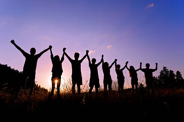 istock silhouettes of people on mountains 504338955