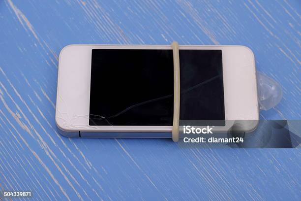 Smartphone With Condoms Protect Against Glass Breakage Stock Photo - Download Image Now