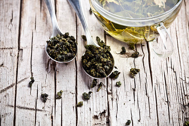 istock cup of green tea and spoons 504340035