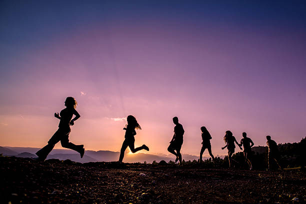 istock Happy Friends Running On Mountains 504340279