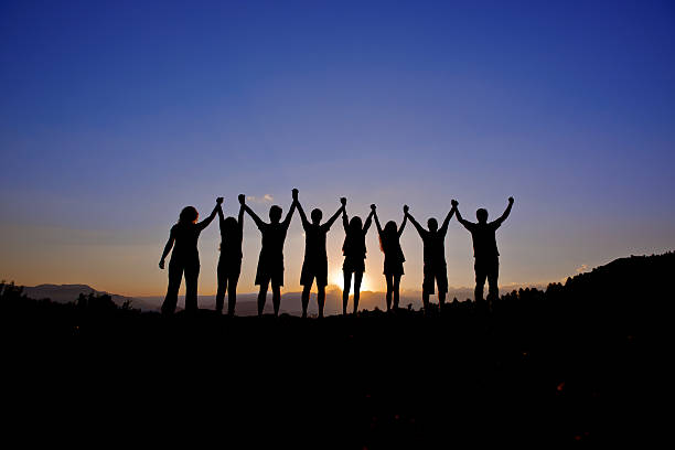 istock silhouettes of people on mountains 504340331