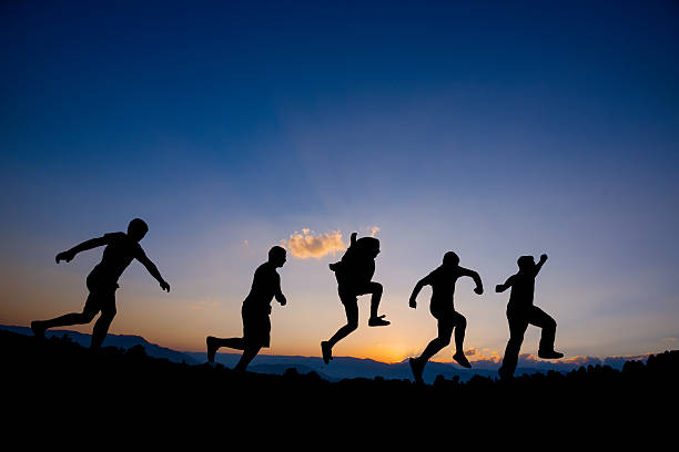 istock Happy Friends Running On Mountains 504340333