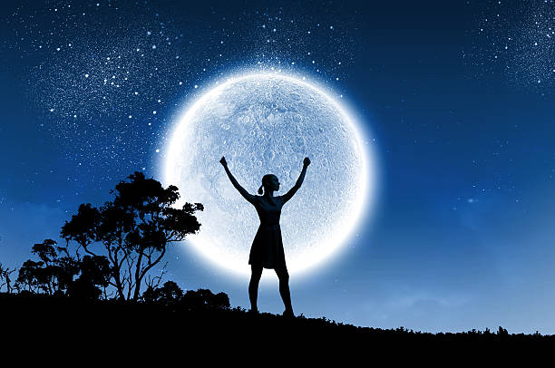 istock Woman and full moon 504341659