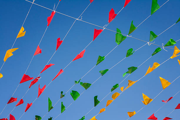 istock Bunting, colorful party flags, on a blue sky. 504342123
