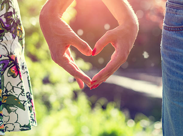 istock Young couple in love holding hands on the sunset during 504342158