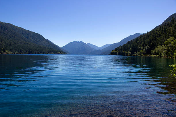 istock Crystal Clear Lake Crescent with Mountain View 504342643