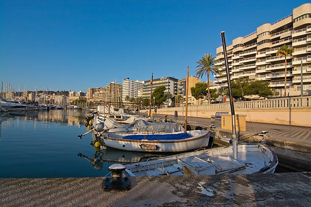 Palma de Mallorca, Balearic islands, Spain - December 22, 2015: Marina with boats along the Paseo Maritimo on a sunny day with blue sky in December.