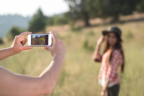 istock young girls take photos 504343923